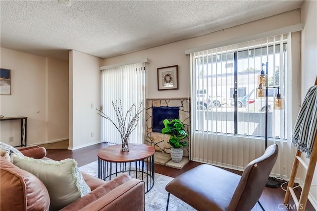 7302 Bright Ave Unit B, Whittier, CA 90602 - living room with a textured ceiling, wood finished floors, and a fireplace