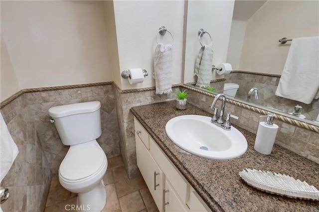 7302 Bright Ave Unit B, Whittier, CA 90602 - bathroom featuring tile walls, vanity, and wainscoting