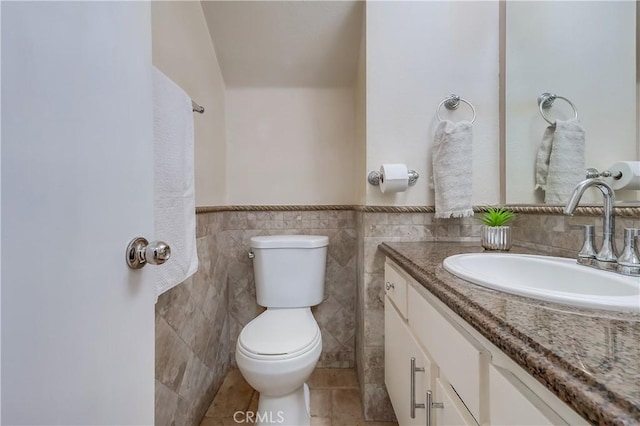7302 Bright Ave Unit B, Whittier, CA 90602 - bathroom with vanity, a wainscoted wall, tile walls, and tile patterned flooring