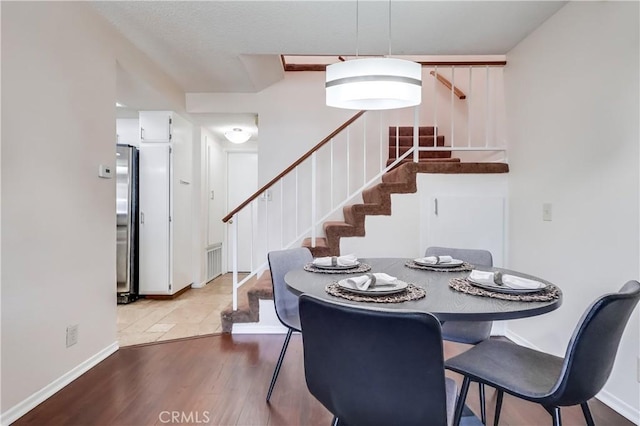 7302 Bright Ave Unit B, Whittier, CA 90602 - dining room featuring stairs and wood finished floors