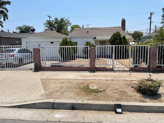 11250 Victory Blvd, North Hollywood, CA 91606 - view of front of house with a fenced front yard, stucco siding, and a garage