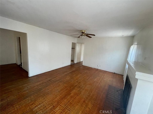 11250 Victory Blvd, North Hollywood, CA 91606 - unfurnished room featuring ceiling fan, wood finished floors, and a fireplace