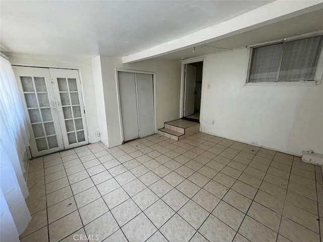 11250 Victory Blvd, North Hollywood, CA 91606 - spare room with light tile patterned floors and french doors