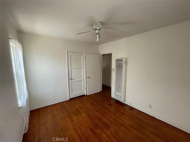 11250 Victory Blvd, North Hollywood, CA 91606 - unfurnished bedroom featuring a heating unit, wood finished floors, and a ceiling fan