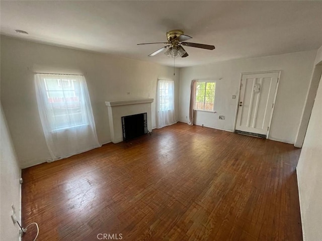 11250 Victory Blvd, North Hollywood, CA 91606 - unfurnished living room featuring ceiling fan, wood finished floors, and a fireplace