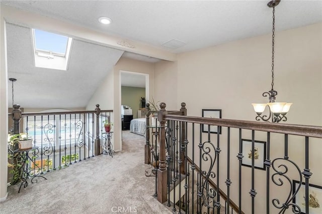 23130 Yvette Ln, Valencia, CA 91355 - corridor featuring carpet floors, a skylight, and an upstairs landing