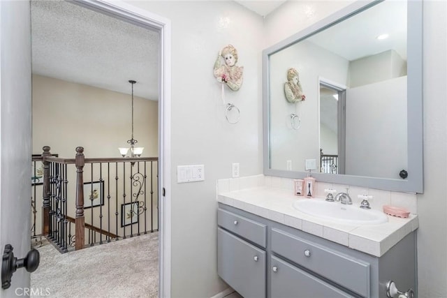 23130 Yvette Ln, Valencia, CA 91355 - bathroom featuring vanity and a chandelier