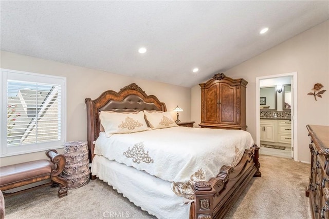 23130 Yvette Ln, Valencia, CA 91355 - bedroom featuring light carpet, recessed lighting, lofted ceiling, and connected bathroom