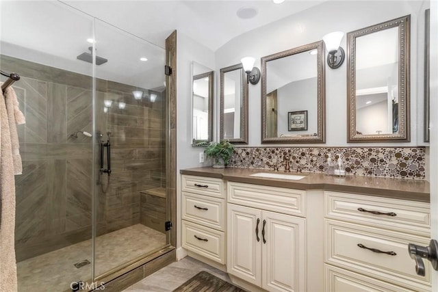 23130 Yvette Ln, Valencia, CA 91355 - bathroom featuring a stall shower, vanity, backsplash, and recessed lighting