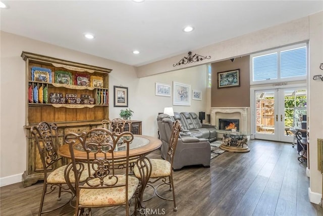 23130 Yvette Ln, Valencia, CA 91355 - dining room featuring wood finished floors, a lit fireplace, and recessed lighting