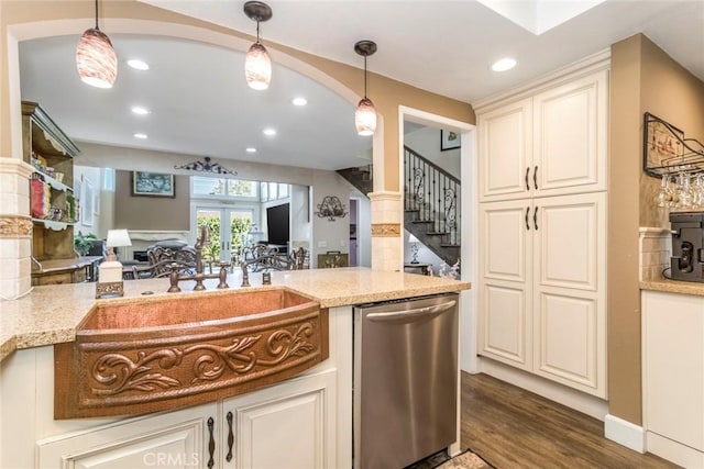 23130 Yvette Ln, Valencia, CA 91355 - kitchen with dishwasher, dark wood finished floors, light stone counters, decorative light fixtures, and recessed lighting