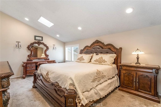 23130 Yvette Ln, Valencia, CA 91355 - bedroom featuring light carpet, a skylight, vaulted ceiling, recessed lighting, and a textured ceiling