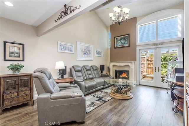 23130 Yvette Ln, Valencia, CA 91355 - living room featuring a chandelier, wood finished floors, high vaulted ceiling, a high end fireplace, and recessed lighting