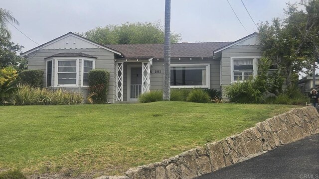 2862 Highland Dr, Carlsbad, CA 92008 - view of front facade with a front lawn and a shingled roof