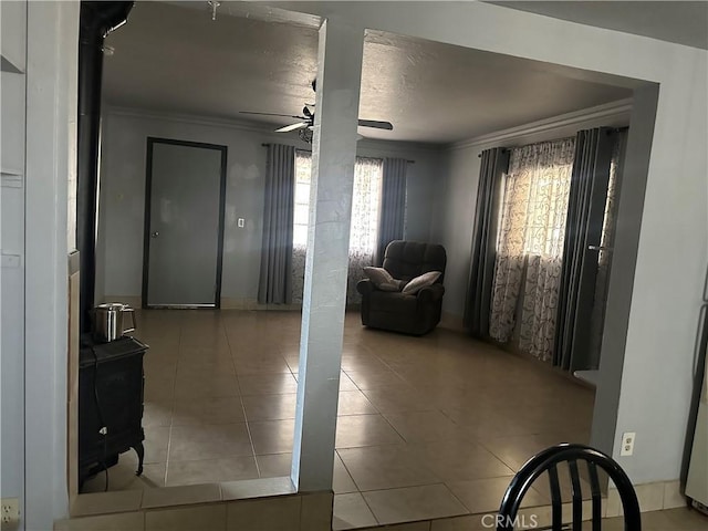 3938 Kreuer Rd, Phelan, CA 92371 - entryway with ceiling fan, ornamental molding, and tile patterned floors