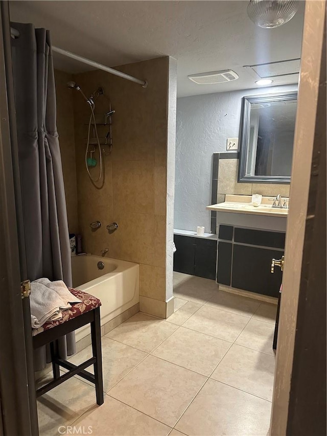 3938 Kreuer Rd, Phelan, CA 92371 - full bath featuring a textured wall, shower / bathtub combination with curtain, vanity, tile patterned flooring, and a textured ceiling