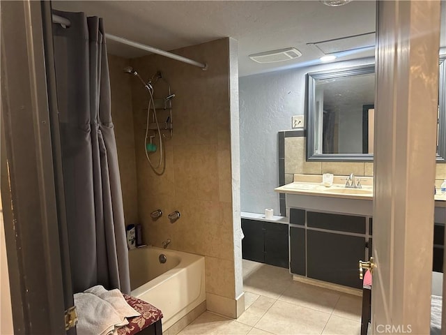 3938 Kreuer Rd, Phelan, CA 92371 - bathroom featuring a textured wall, tile patterned floors, vanity, and shower / bath combo with shower curtain
