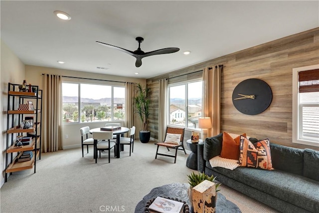17163 Kent St, Hesperia, CA 92345 - carpeted living area with wooden walls, a ceiling fan, and recessed lighting