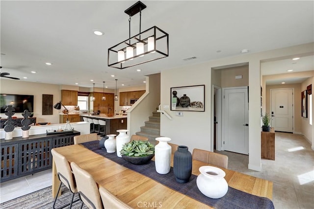 17163 Kent St, Hesperia, CA 92345 - dining room featuring light tile patterned floors, recessed lighting, stairway, and ceiling fan