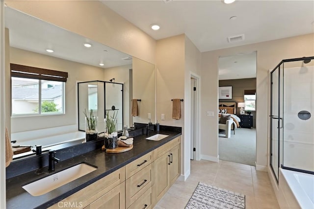 17163 Kent St, Hesperia, CA 92345 - ensuite bathroom with a garden tub, double vanity, a shower stall, recessed lighting, and tile patterned flooring