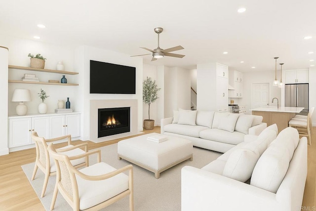6815 La Jolla Scenic Dr, La Jolla, CA 92037 - living room with a ceiling fan, light wood-style flooring, recessed lighting, and a fireplace with flush hearth