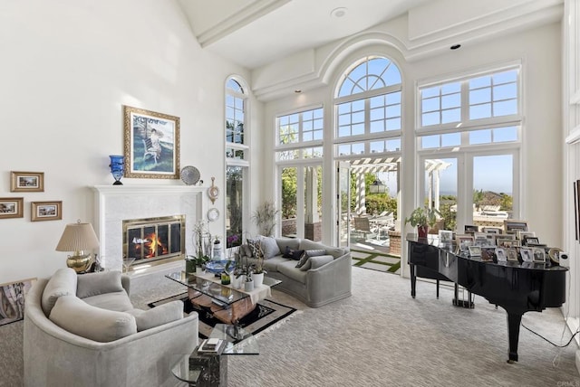 6815 La Jolla Scenic Dr, La Jolla, CA 92037 - living room with a towering ceiling, carpet flooring, and a glass covered fireplace
