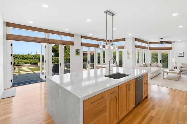6815 La Jolla Scenic Dr, La Jolla, CA 92037 - kitchen with light wood-style floors, recessed lighting, open floor plan, a ceiling fan, and a kitchen island with sink
