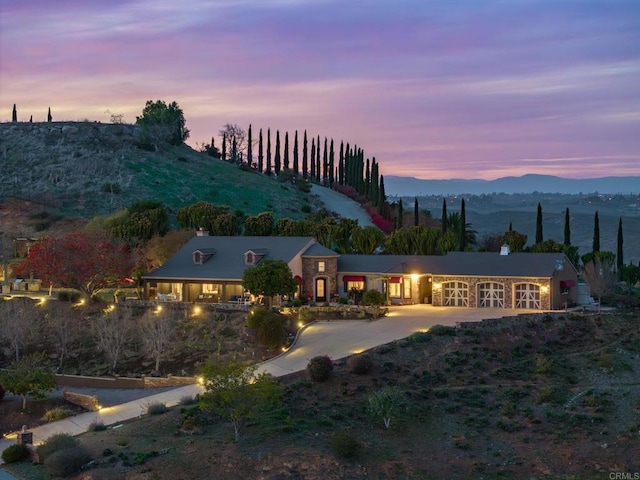 30419 Canyon Estates Rd, Vista, CA 92084 - back of property at dusk featuring a chimney and a mountain view