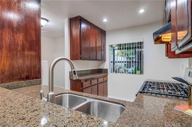 4140 Workman Mill Rd Unit 78, Whittier, CA 90601 - kitchen featuring light stone counters, range with gas cooktop, premium range hood, and recessed lighting