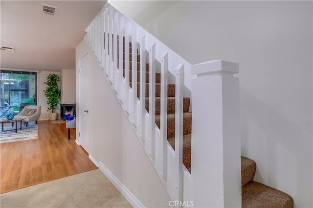 4140 Workman Mill Rd Unit 78, Whittier, CA 90601 - staircase featuring baseboards and wood finished floors
