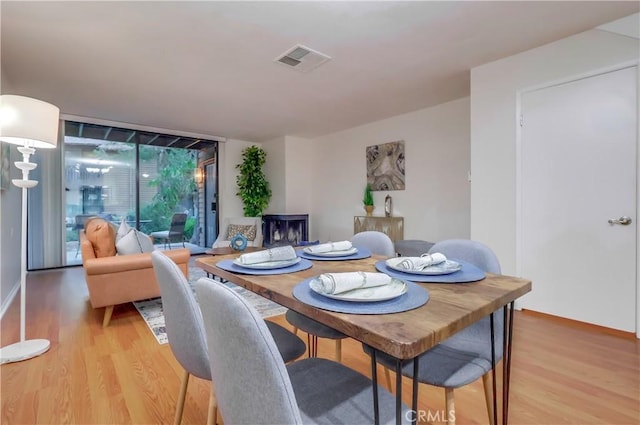 4140 Workman Mill Rd Unit 78, Whittier, CA 90601 - dining space featuring light wood-type flooring and a wall of windows