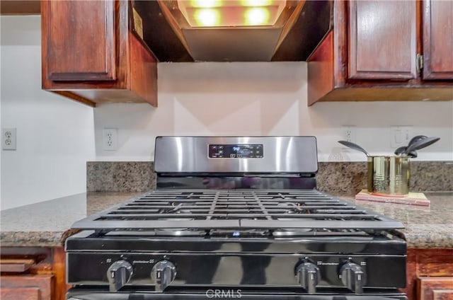 4140 Workman Mill Rd Unit 78, Whittier, CA 90601 - kitchen view of exhaust hood, range with gas stovetop, and light stone countertops