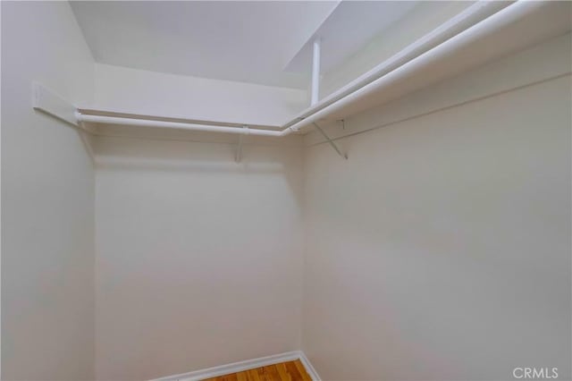 4140 Workman Mill Rd Unit 78, Whittier, CA 90601 - walk in closet featuring wood finished floors