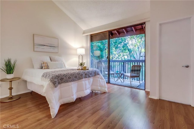 4140 Workman Mill Rd Unit 78, Whittier, CA 90601 - bedroom with access to outside, vaulted ceiling, and wood finished floors
