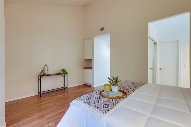 4140 Workman Mill Rd Unit 78, Whittier, CA 90601 - bedroom featuring wood finished floors and a towering ceiling