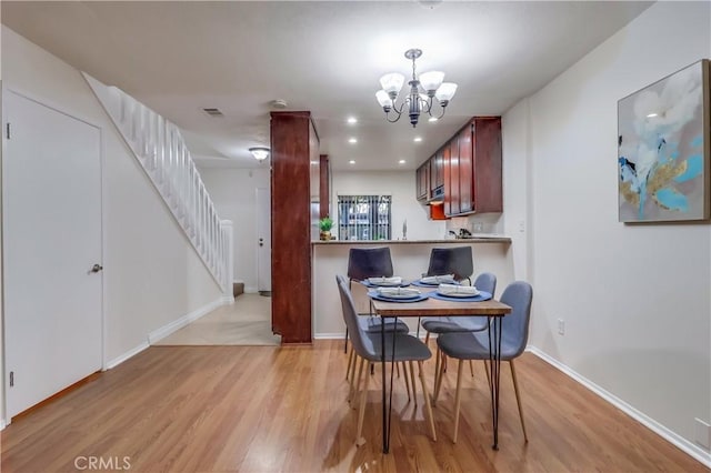 4140 Workman Mill Rd Unit 78, Whittier, CA 90601 - dining space featuring light wood-type flooring, stairway, a chandelier, and recessed lighting