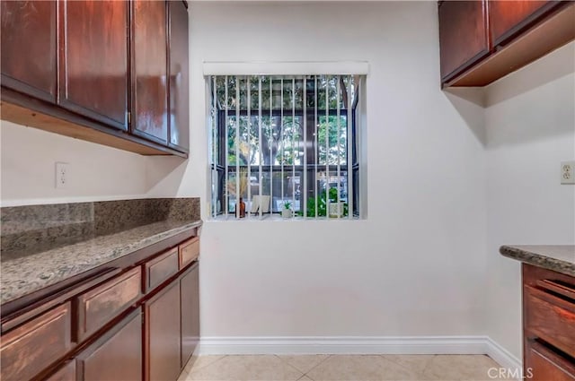 4140 Workman Mill Rd Unit 78, Whittier, CA 90601 - kitchen featuring stone countertops and light tile patterned floors