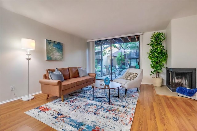 4140 Workman Mill Rd Unit 78, Whittier, CA 90601 - living area featuring wood finished floors and a multi sided fireplace