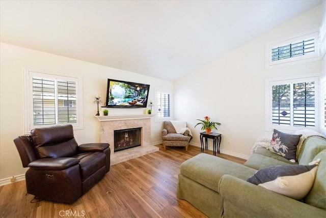 5260 W Palmer Dr, Banning, CA 92220 - living area featuring wood finished floors, a premium fireplace, and high vaulted ceiling