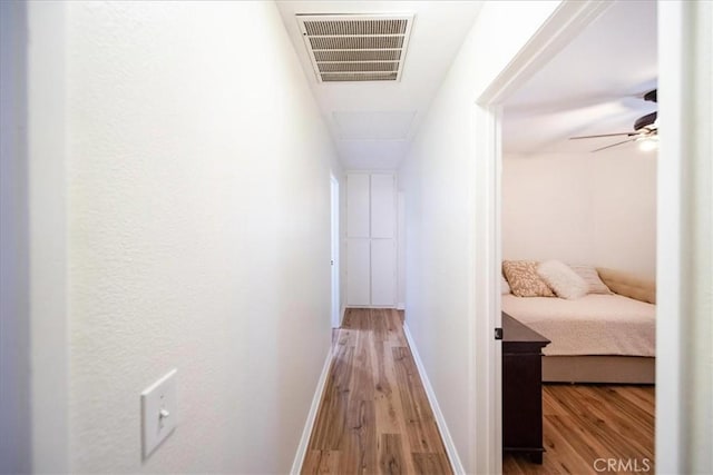 5260 W Palmer Dr, Banning, CA 92220 - corridor featuring light wood finished floors and baseboards