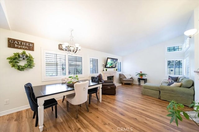5260 W Palmer Dr, Banning, CA 92220 - dining space with a chandelier, light wood-type flooring, and high vaulted ceiling