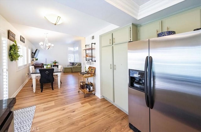 5260 W Palmer Dr, Banning, CA 92220 - kitchen featuring stainless steel refrigerator with ice dispenser, plenty of natural light, a chandelier, light wood-style flooring, and crown molding