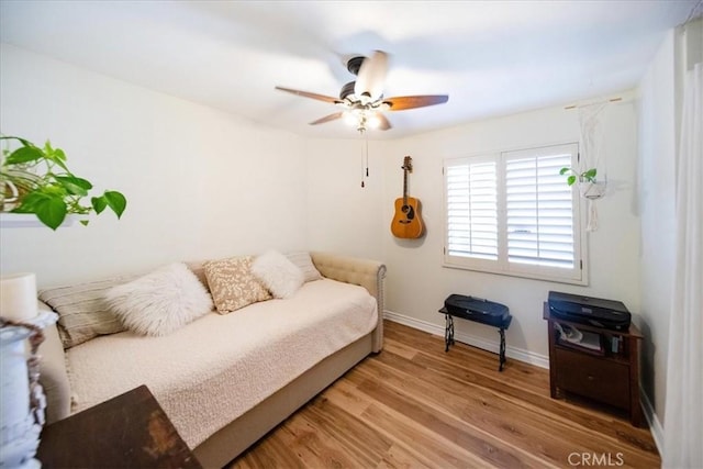 5260 W Palmer Dr, Banning, CA 92220 - bedroom with wood finished floors and ceiling fan