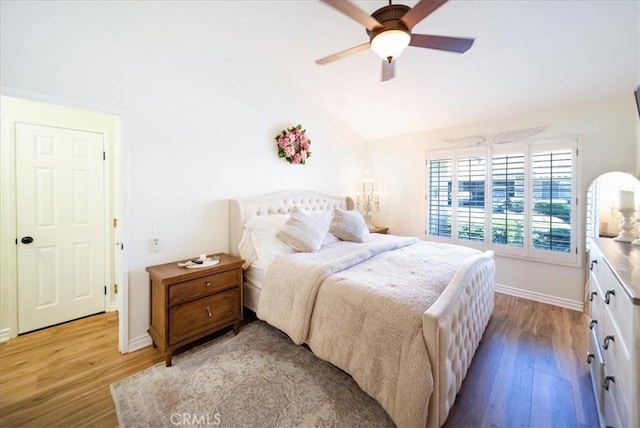 5260 W Palmer Dr, Banning, CA 92220 - bedroom with light wood finished floors, vaulted ceiling, and a ceiling fan