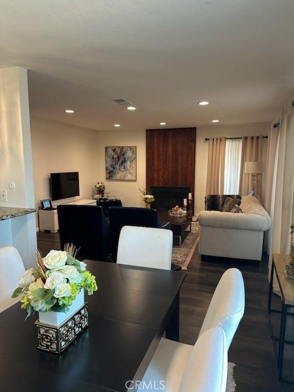 450 W Vermont Ave Unit 1104, Escondido, CA 92025 - dining area featuring dark wood-style floors, recessed lighting, and a fireplace