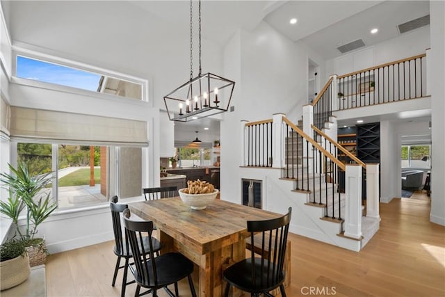 5025 Stonehaven Dr, Yorba Linda, CA 92887 - dining area with a towering ceiling, stairway, light wood-type flooring, beverage cooler, and recessed lighting