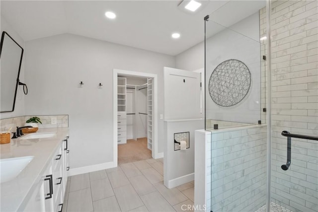 5025 Stonehaven Dr, Yorba Linda, CA 92887 - bathroom featuring a spacious closet, double vanity, a shower stall, recessed lighting, and vaulted ceiling