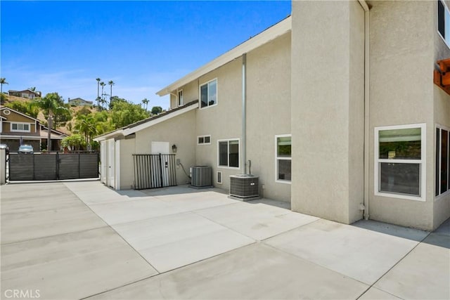 5025 Stonehaven Dr, Yorba Linda, CA 92887 - rear view of property with stucco siding, a patio, and a gate