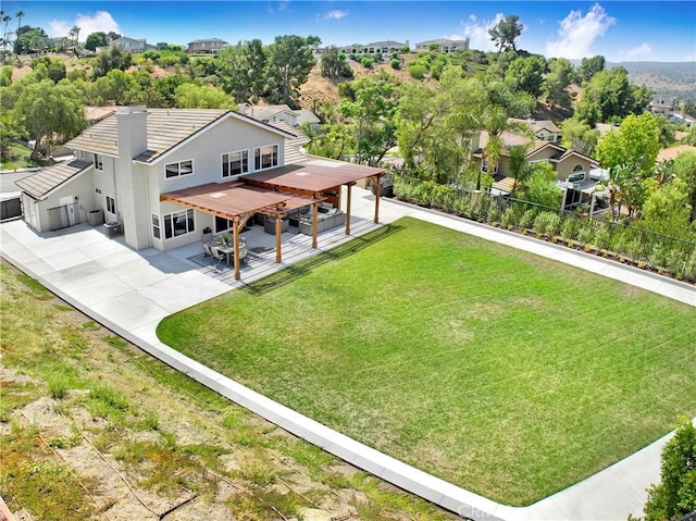5025 Stonehaven Dr, Yorba Linda, CA 92887 - back of property with a patio area, a fenced backyard, and stucco siding