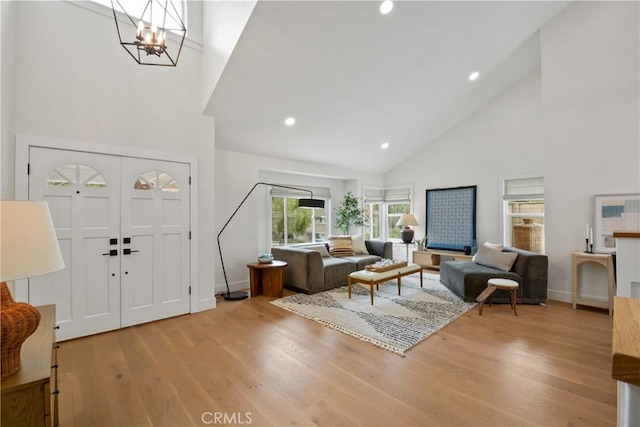 5025 Stonehaven Dr, Yorba Linda, CA 92887 - living area with high vaulted ceiling, wood finished floors, a chandelier, and recessed lighting